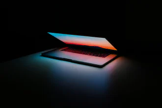 A half-open glowing computer notebook