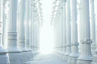 Two long rows of white stone columns