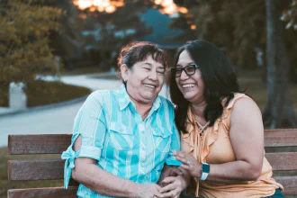 Two related women on a bench